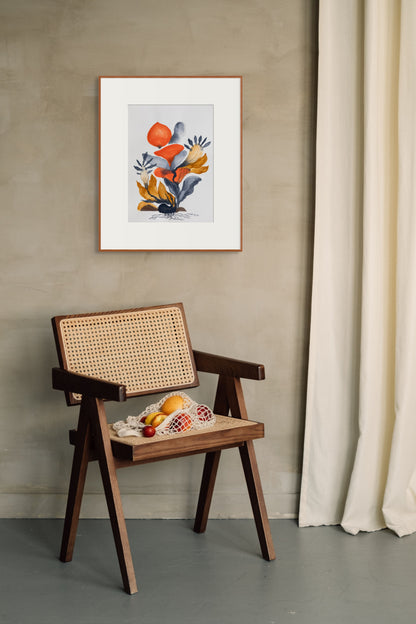 Wooden chair with woven backrest against a beige wall with a framed artwork.
